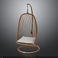 Orange Rattan Bird Nest Hanging Chair With White Cushion And Gray Background