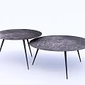 Two Round Coffee Tables With Cracked Texture Dark Surface And Black Slender Legs