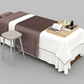 Comfortable Massage Bed With Brown And White Sheets Stool And Wooden Tray