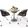 Modern Round Wooden Table and Black Rolling Chairs Set with Small Plant and Magazine