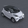 White Compact Electric Car With Modern Design And LED Headlights In Outdoor Building Setting