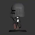 Chibi Style Mandalorian Toy Figure With Silver Helmet Detailed Weapon And Black Base