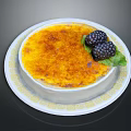 Creamy Creme Brulee With Caramelized Top Blackberries And Mint Leaf On Patterned Plate