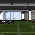 Modern Indoor Fitness Area With Football Field Turf White Exercise Chairs And Large Windows