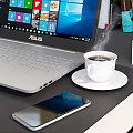 Organized Home Office Desk Setup With Laptop Books Coffee Cup And Lamp