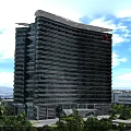 Modern High Rise Office Building With Glass Curtain Wall Red Logo And Surrounding Green Trees Blue Sky