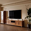 Wooden TV Stand In Living Room With Decorative Wall Moldings And Large Plant