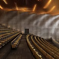 Spacious Auditorium Interior With Rows Of Seats Curved Wooden Ceiling And Stone Walls