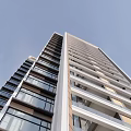 Stunning Modern High Rise Building Exterior With Glass Windows And Balconies