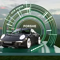 Porsche Sports Car Photo Check in Spot with Green Circular Structure and Sunset Sky