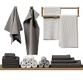 Different Styles Of Gray And White Towels Hanging Folded And Rolled On