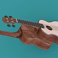 Two Wooden Ukuleles In Light And Dark Brown Lying On Teal Background