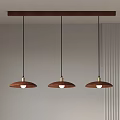 Three Pendant Lights with Brown Shades and Black Cords Hanging from Wooden Bar on Ceiling