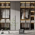 Modern Gray Wardrobe With Multiple Storage Shelves Hanging Rods And Decorative Plant In Room