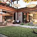 Traditional Guesthouse Architecture With Courtyard Stone Pathways Outdoor Seating And Greenery