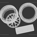 Stacked Black Car Tires with Alloy Rims and Red Brake Calipers