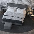 Modern Double Bed With Gray Headboard Black White Checkered Quilt White Pillows Stool And Lamp