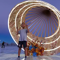 Giant Cone Shaped Garden Ornament With Colorful Balls Red Balloon And People In Open Square
