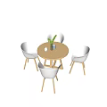 Modern Round Wooden Table With Four White Chairs Green Plant Vase Cup And Teapot