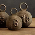 Vintage Cast Iron Weight Ornaments With Numbers On Wooden Surface Dark Background