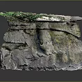 Natural Rock Formation With Green Moss Covered Top And Textured Stone Base Structure