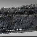 Majestic Rocky Cliff Scenery With Layered Rock Texture And Sparse Vegetation