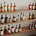 Organized Display Of Various Wine Bottles And Glasses On Wooden Shelves