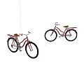 Two Red Bicycles with Brown Seats and Baskets on White Background 3d model