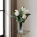 White Tulips And Eucalyptus Leaves In Transparent Striped Vase For Home Decor On Glass Table