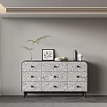 Stylish Console Cabinet Sideboard With Patterned Drawers And Decorative Potted Plant Picture Frame