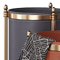 Navy Blue And Brown Storage Bins With Gold Accents Holding Folded Umbrella And Cover