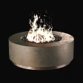 Modern Minimalist Round Stone Fireplace With Burning Flames And Black Pebbles