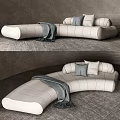 Cozy Modern Curved Sectional Sofa Light Colored With Gray Pillows And Throw Blanket 3d model
