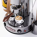 Stainless Steel Coffee Machine With Coffee Beans And White Cups In Kitchen