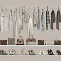 Stylish Clothes Hanging on Wall with Designer Handbags and High Heels on Shelves