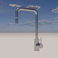 Sleek Modern Stainless Steel Faucet on Gray Countertop with Minimalist Design