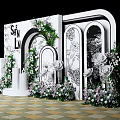 Elegant Wedding Backdrop With White Arch Green Plants And Floral Decorations On Checkerboard Floor