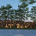 Outdoor Scenic Wall with Illuminated Engraved Characters Surrounded by Green Trees in Public Area