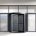 Modern Revolving Door With Glass Panels And Surrounding Glass Facade For Commercial Entrance