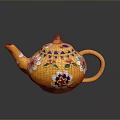 Decorative Yellow Teapot With Vibrant Floral Patterns And Golden Handle Spout