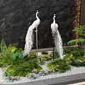 White Peacock Sculptures Indoor Landscape With Green Plants White Gravel And Dark Marble Wall