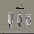 Three White Urinals Mounted On Beige Wall With Black Shelf Holding Decorations And Aromatherapy
