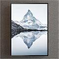 Scenic Mountain Landscape With Snow Capped Peak And Calm Lake Surface Reflection