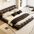 Modern Black Leather Tufted Double Bed With White Black Pillows Blanket Area Rug And Armchair