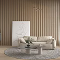 Elegant Living Room Interior Featuring Round Table Dried Flower Arrangement Black Vase And Beige Sofa