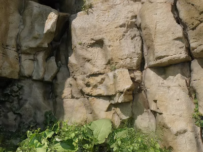 Natural Rockery Stones With Rough Surface And Green Foliage Below 3d model
