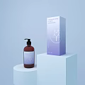 Decorative Ornament Set With Brown Pump Bottle And Purple Box On White Display Stand