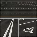 Asphalt Road Surface With White Lane Lines And Handicap Parking Symbol