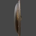 Ancient Bronze Shield with Red Leather Edging and Metal Rivets as Historical Weapon