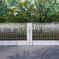 Modern Building Facade With Metal Railings Green Plants And Stone Pavement
